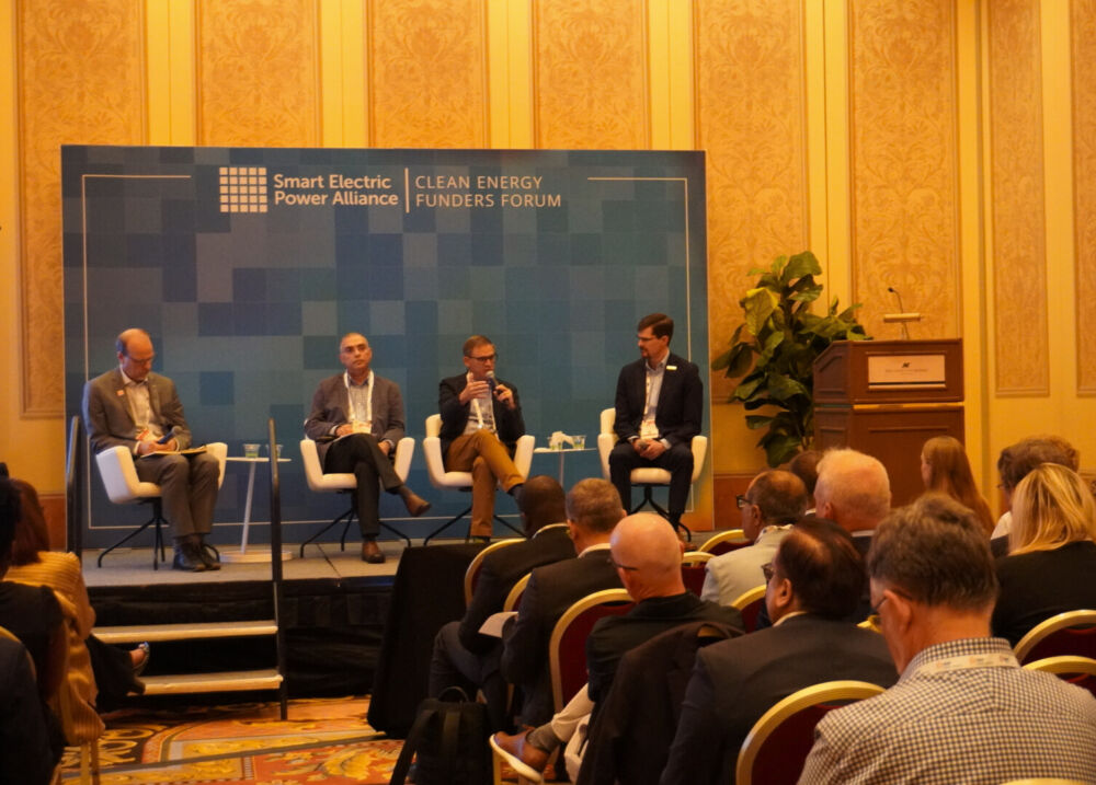 speakers on stage at. SEPA's inaugural Clean Energy Funders Forum