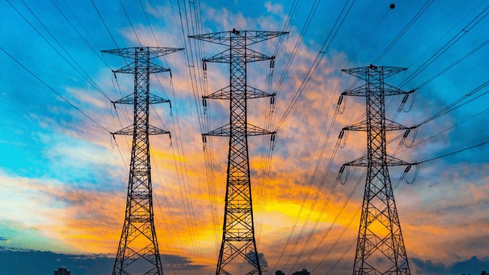 3 power lines with the sunset behind them